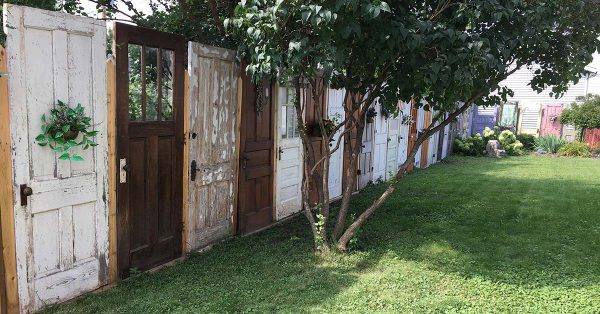 Yard Fence Made Out Of Old Doors Decor Home Ideas