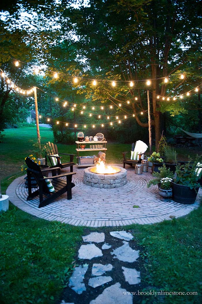 Cottage Backyard with String Lights and Stone Fire Pit #backyard #outdoorspaces #decorhomeideas