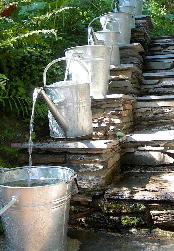 Upcycle Watering Feature Used Cans and Buckets