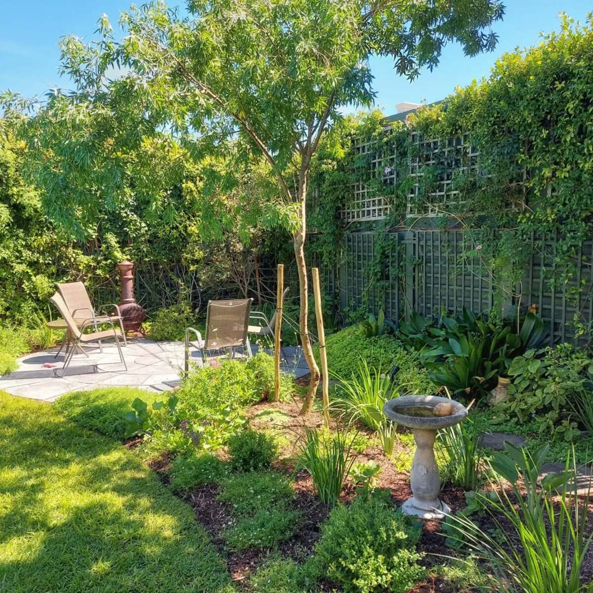 corner garden ideas for a cozy backyard 5